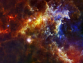 米航空宇宙局（NASA）などが公表した、銀河や星雲の画像、地球の衛星写真などを紹介する。

写真は、宇宙望遠鏡ハーシェル（Herschel）が撮影したロゼット星雲（Rosette Nebula）付近の画像。

ハーシェルに搭載された光伝導体アレイカメラ・分光計（Photodetector Array Camera and Spectrometer、PACS）とスペクトル測光撮像器（Spectral and Photometric Imaging Receiver、SPIRE)がとらえた画像で、塵（ちり）から発生した赤外光をとらえている。画像は、青色（70ミクロン）、緑色（160ミクロン）、赤色（250ミクロン）の3つの赤外線波長が合成されている。

ロゼット星雲は地球から約5000光年離れたいっかくじゅう座（Monoceros）にあり、星を生みだしている。しみ状になった明るい部分は、塵が繭（まゆ）のようになっており、星の胚が含まれている。星の胚は成長すると、太陽の質量の 10倍ある巨大な星になる。画像中央の小さな点は、より小さな質量の星の胚で、ロゼット星雲は画像の右側にある（2010年4月14日公開）。(c)AFP/NASA/ESA