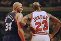Phoenix Suns forward Charles Barkley (34) laughs at a foul call with Chicago Bulls guard Michael Jordan (23) in the first half 28 January 1996 at the United Center in Chicago. (c)AFP/Brian BAHR