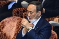 衆院予算委員会に出席する菅義偉首相（2021年1月22日撮影）。(c)Kazuhiro NOGI / AFP