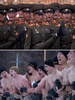 北朝鮮・平壌で軍事パレードを行う北朝鮮軍（上、2015年10月10日撮影）と韓国・平昌で行われた軍事演習に参加する米海兵隊員（下、2017年1月24日撮影）。(c)AFP/Ed JONES