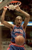 Detroit Pistons Grant Hill makes a slam dunk in the first half of the Pistons NBA game against the New Jersey Nets, 21 December 1994, in East Rutherford, New Jersey. (c)AFP/MARK D. PHILLIPS
