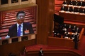 中国全国人民代表大会（全人代）で大型スクリーンに映る習近平国家主席（2021年3月8日撮影）。(c)CELIS / AFP