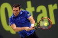 男子テニス、カタール・エクソンモービル・オープン（Qatar ExxonMobil Open 2014）シングルス2回戦。リターンを打つトビアス・カムケ（Tobias Kamke、2014年1月1日撮影）。(c)AFP/MARWAN NAAMANI
