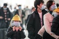 マスクを着けた子ども。中国湖北省で（2022年1月17日撮影、資料写真）。(c) AFP