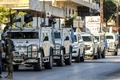 レバノン南部マルジャユン付近をパトロールする国連レバノン暫定軍（UNIFIL）の車両（2024年10月8日撮影）。(c)AFP
