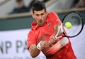 全仏オープンテニス、男子シングルス準々決勝。リターンを打つノバク・ジョコビッチ（2022年6月1日撮影）。(c)Anne-Christine POUJOULAT / AFP