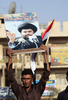 イラク・バグダッド（Baghdad）で、反米デモを行うイスラム教シーア派（Shiite）反米指導者ムクタダ・サドル（Moqtada al-Sadr）師の支持者ら（2008年10月18日撮影）。(c)AFP/AHMAD AL-RUBAYE
