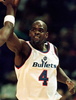 Washington Bullets Chris Webber high-fives a teammate in the first quarter of the NBA game against the Milwaukee Bucks 12 December in Landover, Maryland. (c)AFP/Ted MATHIAS