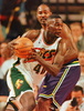 Seattle SuperSonics&apos; Shawn Kemp (FRONT) goes to the basket past Karl Malone of the Utah Jazz 02 June during first half action of game seven of the Western Conference Finals at KeyArena in Seattle, WA. (c)AFP/Dan LAVINE