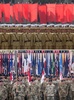 北朝鮮・平壌で軍事パレードを行う北朝鮮兵（上、2013年7月27日撮影）と韓国平沢近郊にある在韓米軍のハンフリーズ基地の米兵（下、2017年6月28日撮影）。(c)AFP/Ed JONES