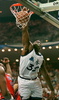 Orlando Magic center Shaquille O&apos;Neal slam dunks the ball over Detroit Pistons center Mark West (L) during the second period of their first round NBA playoff game at the Orlando Arena 28 April. (c)AFP/Tony RANZE
