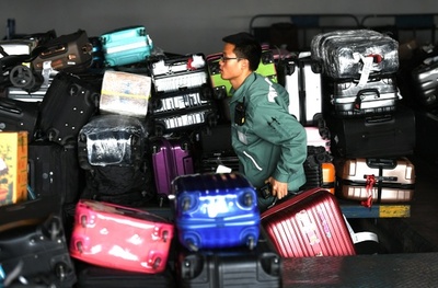 春節中、作業員1人が扱う荷物量は1日約1200件、14トン アモイの空港