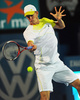 テニス、アピア国際（2013 Apia International Sydney Tennis Tournament）は12日、オーストラリアのシドニー（Sydney）で男子シングルス決勝が行われ、南アフリカのケビン・アンダーソン（Kevin Anderson）は3-6、7-6、3-6でオーストラリアのバーナード・トミック（Bernard Tomic）に敗れた。

リターンを打つケビン・アンダーソン（2013年1月12日撮影）。(c)AFP/Greg WOOD