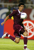 ボールをコントロールするカタールの%%Andres Quintana%%。(c)AFP/LIU Jin