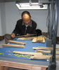 西蔵自治区博物館で貝多羅葉経典を整理する久米次成（ＧｙｕｍｅｙＴｓｕｌｔｒｉｍ）さん（2008年6月26日撮影）。(c)Xinhua News