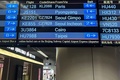 北朝鮮国営・高麗航空の到着予定が表示された中国・北京首都国際空港の掲示板（2023年8月21日撮影）。(c)Oliver HOTHAM / AFP