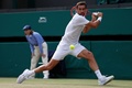 テニス、ウィンブルドン選手権、男子シングルス3回戦。リターンを打つマリン・チリッチ（2021年7月3日撮影）。(c)Adrian DENNIS / AFP
