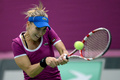 女子テニス、国別対抗戦のフェドカップ（2013 Fed Cup）は10日、ワールドグループ1部の1回戦が各地で行われ、第3試合でロシアのエレナ・ベスニナ（Elena Vesnina）は4-6、1-6で森田あゆみ（Ayumi Morita）に敗れた。

リターンを打つエレナ・ベスニナ（2013年2月10日撮影）。(c)AFP/