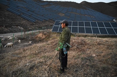 五輪前に犠牲強いられる農家 中国で再生可能エネルギー開発ラッシュ