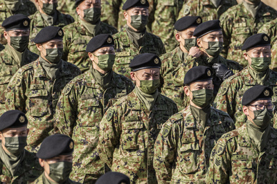 Japan changes rules to allow aid to foreign militaries
