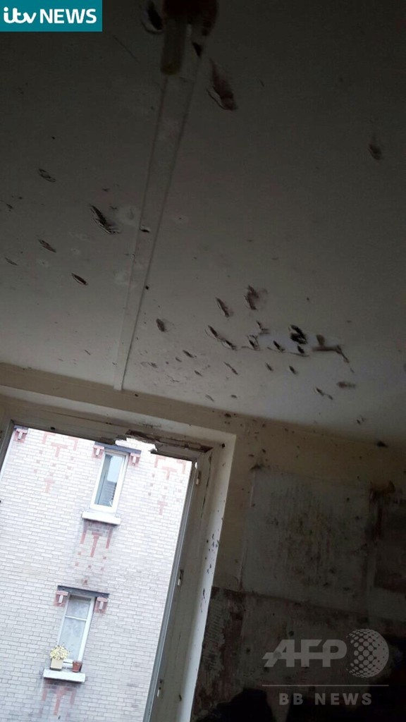 弾痕残るパリ郊外のアパート、容疑者拘束作戦の現場 映像公開