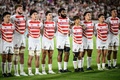 ラグビー、パシフィック・ネーションズカップ決勝、フィジー対日本。試合前の国歌斉唱に臨む日本の選手（2024年9月21日撮影）。(c)Philip FONG/ AFP