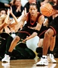 Philadelphia 76ers player Allen Iverson looks for a pass from teammate George Lynch (R) during their game against the Seattle SuperSonics 22 March, 1999. (c)AFP/Dan LEVINE
