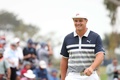 男子ゴルフ米国ツアーのメジャー第3戦、第121回全米オープン選手権最終日。8番グリーンで笑顔を見せるブライソン・デシャンボー（2021年6月20日撮影）。(c)Harry How/Getty Images/ AFP