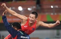 リオデジャネイロ五輪、レスリング男子フリースタイル65キロ級の3位決定戦で、試合に勝利したと思いガッツポーズを見せるモンゴルのガンゾリグ・マンダフナラン（2016年8月21日撮影）。(c)AFP/Jack GUEZ