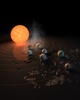 赤色矮星「TRAPPIST-1」を公転する7つの惑星を描いた想像図。米航空宇宙局（NASA）ウェブサイトより。(c)NASA/JPL-Caltech