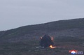 北朝鮮で実施された戦術弾道ミサイルの発射実験。着弾直後の様子。朝鮮中央通信（KCNA）公開（撮影場所不明、2024年9月18日撮影、19日公開）。(c)AFP PHOTO/KCNA VIA KNS