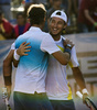 男子テニスのラファエル・ナダル（Rafael Nadal、スペイン）が5日、VTRオープン（VTR Open 2013）で7か月ぶりの実戦復帰を果たし、アルゼンチンのフアン・モナコ（Juan Monaco）と組んだ男子ダブルス1回戦で勝利を収めた。

試合に勝利し、ラファエル・ナダル（手前）と喜びを分かち合うフアン・モナコ（2013年2月5日撮影）。(c)AFP/MARTIN BERNETTI