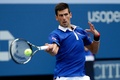全米オープンテニス、男子シングルス1回戦。リターンを狙うノバク・ジョコビッチ（2015年8月31日撮影）。(c)AFP/Getty Images/Michael Heiman