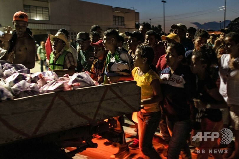 【記者コラム】ありのままに伝える──「移民集団」の写真で最高賞受賞のカメラマン