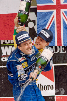 dpa) - German formula 1 pilot Michael Schumacher jubilates with