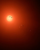 赤色矮星「TRAPPIST-1」を公転する7つの惑星を描いた想像図。米航空宇宙局（NASA）ウェブサイトより。(c)NASA/JPL-Caltech