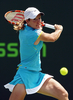 バックハンドで応戦するジュスティーヌ・エナン。(c)AFP/Getty Images/Clive Brunskill