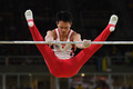 リオデジャネイロ五輪、体操男子予選。鉄棒の演技に臨む田中佑典（2016年8月6日撮影）。(c)AFP/Ben STANSALL