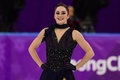 平昌冬季五輪、フィギュアスケート女子シングル・ショートプログラム（SP）の演技後に笑顔を見せるケイトリン・オズモンド（2018年2月21日撮影）。(c)AFP/Roberto SCHMIDT