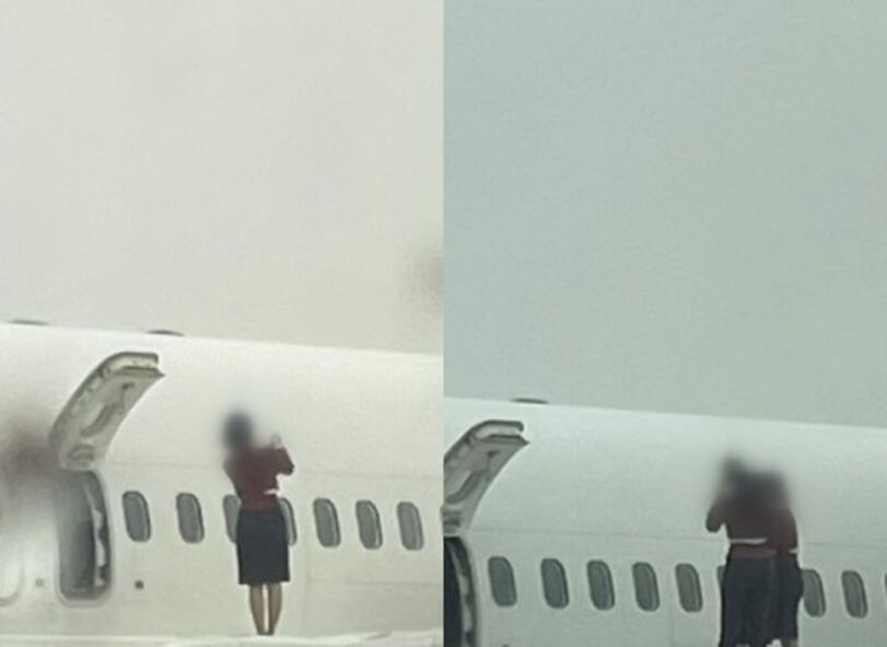 航空機の翼の上に登って認証ショットを撮影する乗務員＝JTBC(c)NEWSIS