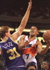 Utah Jazz forward Adam Keefe (L) attempts to block a shot from the Phoenix Suns guard Kevin Johnson during third quarter action in Phoenix 28 November. The Jazz won  114-105. (c)AFP/BOB DUNN
