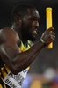 第15回世界陸上北京大会、男子4×100メートルリレー決勝にジャマイカの第3走者として臨むニッケル・アシュミード（2015年8月29日撮影）。(c)AFP/GREG BAKER