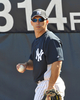 米大リーグ（MLB）、ニューヨーク・ヤンキース（%%New York Yankees%%）は18日、野手陣がフロリダ州タンパのジョージ・M・スタインブレナー（George M. Steinbrenner Field）で行われているキャンプに合流し練習を開始した。写真はウォーミングアップをするジョー・ジラルディ（%%Joe Girardi%%）監督。(c)AFP/Getty Images/Al Messerschmidt