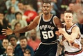 Seattle Supersonic Detlef Schrempf (R) tries to tie up San Antonio Spurs David Robinson (L) during first quarter action of their game in Seattle, WA on 26 February. (c)AFP/Dan Levine