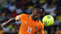 サッカー2013アフリカネイションズカップ（2013 The Africa Cup of Nations）は30日、グループDの2試合が行われ、コートジボワールはアルジェリアと2-2で引き分けた。

ボールを追いかけるコートジボワールのディディエ・ドログバ（Didier Drogba、2013年1月30日撮影）。(c)AFP/ALEXANDER JOE
