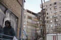 ロシア・マグニトゴルスクで、ガス爆発により崩壊した住居ビルで続く捜索活動（2019年1月1日撮影）。(c)AFP