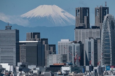 Mount Fuji behind Tokyo skyscrapers