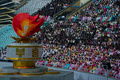 北朝鮮・平壌（Pyongyang）の綾羅島メーデースタジアム（Rungnado May Day Stadium、収容人数15万人）で26日、恒例の「アリラン祭（Arirang Festival）」のマスゲームが行われた。

朝鮮戦争の休戦60周年をテーマに行われる今年のマスゲームには約10万人が参加。一糸乱れぬ体操やダンス、アクロバットなどの集団パフォーマンスや演劇などが披露される（2013年7月26日撮影）。(c)AFP/Ed Jones