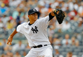 米大リーグ（MLB）、ニューヨーク・ヤンキース（New York Yankees）の黒田博樹（Hiroki Kuroda）は18日、トロント・ブルージェイズ（Toronto Blue Jays）戦に先発登板し、7回を投げ4安打無失点、5奪三振で今季9勝目を挙げた。

試合は7回に雨天コールドとなり、ヤンキースが6-0で勝利した。

先発登板するニューヨーク・ヤンキースの黒田博樹（2012年7月18日撮影）。(c)AFP/Getty Images/Jim McIsaac