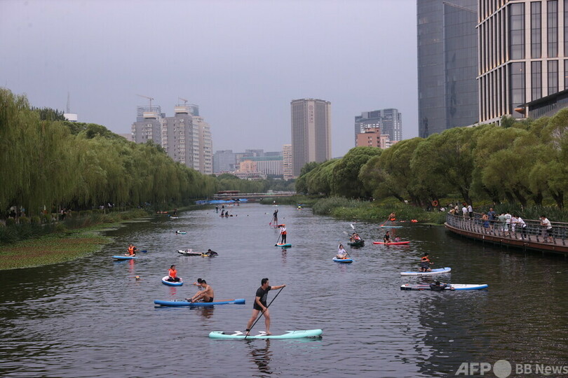 暑さ対策グッズ売れる猛暑の中国 ペット用まで登場